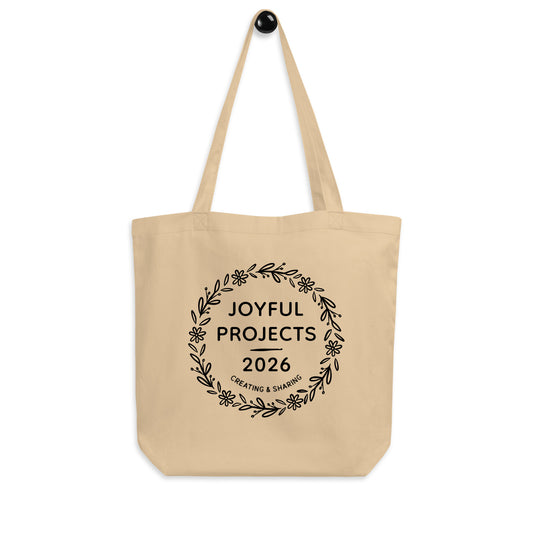 Eco-friendly organic cotton tote bag with minimalist Joyful Projects 2026 print, front view.