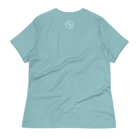 Back of the WIP Warrior women’s relaxed crochet t-shirt in heather blue lagoon with a small white Yarn Over Hook crochet community logo near the collar.