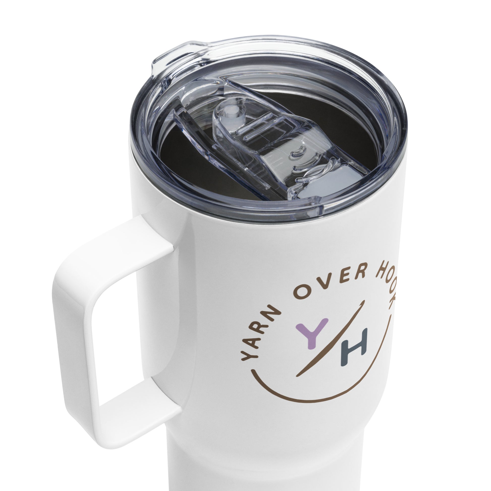 Close-up of white 25 oz Yarn Over Hook travel mug with clear lid and printed crochet community logo