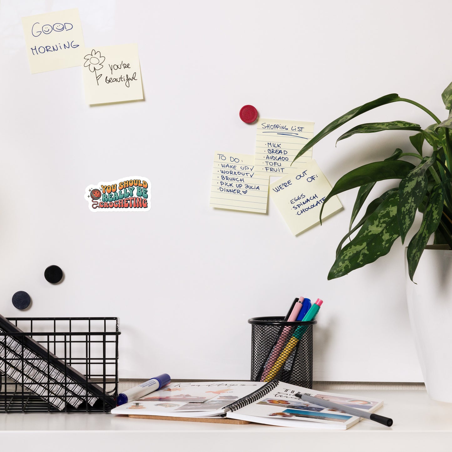 4x4 You Should Really Be Crocheting’ crochet magnet displayed on a whiteboard holding notes.