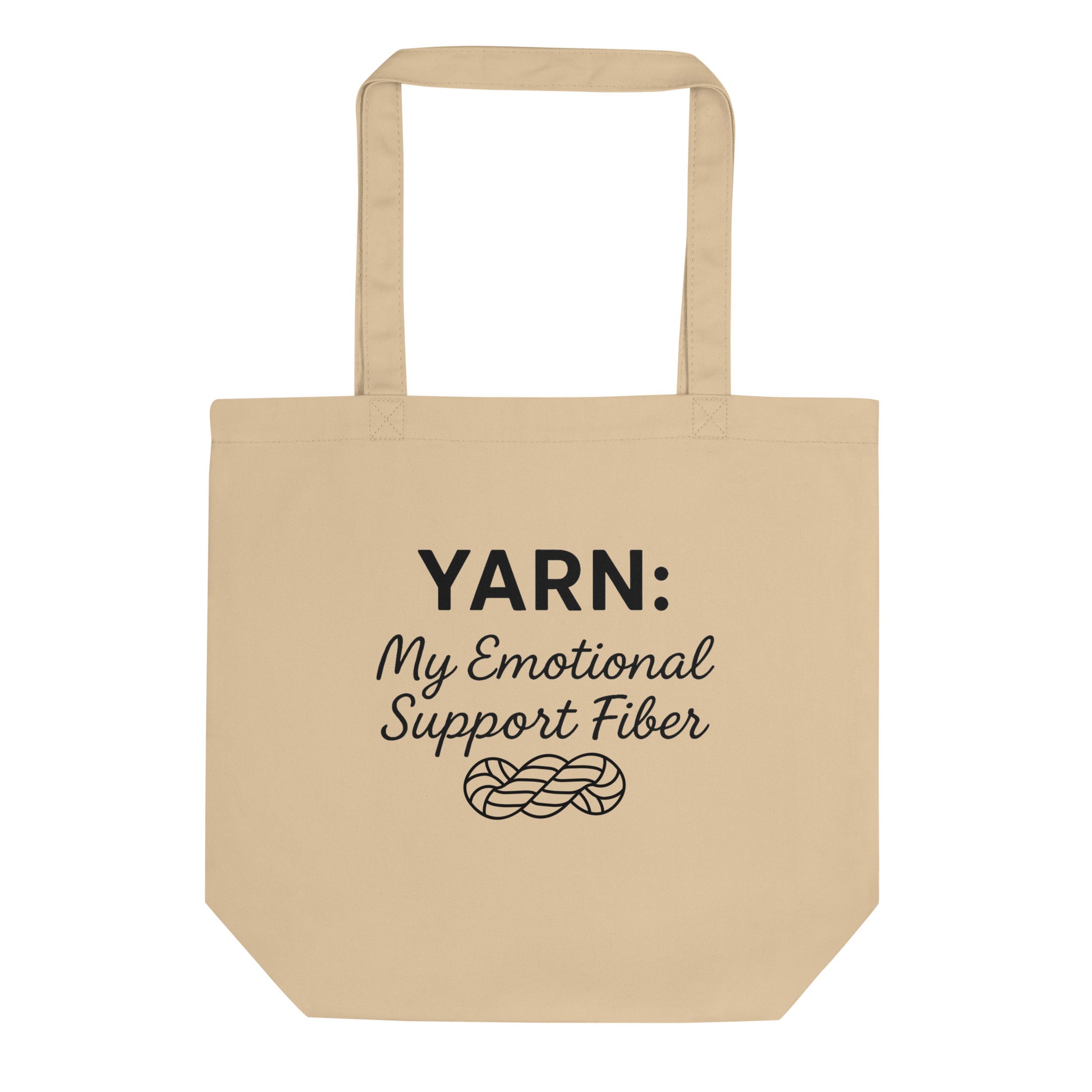 Front view of an Oyster-colored organic cotton tote bag with the black “Yarn: My Emotional Support Fiber” design and yarn skein illustration printed on the center.