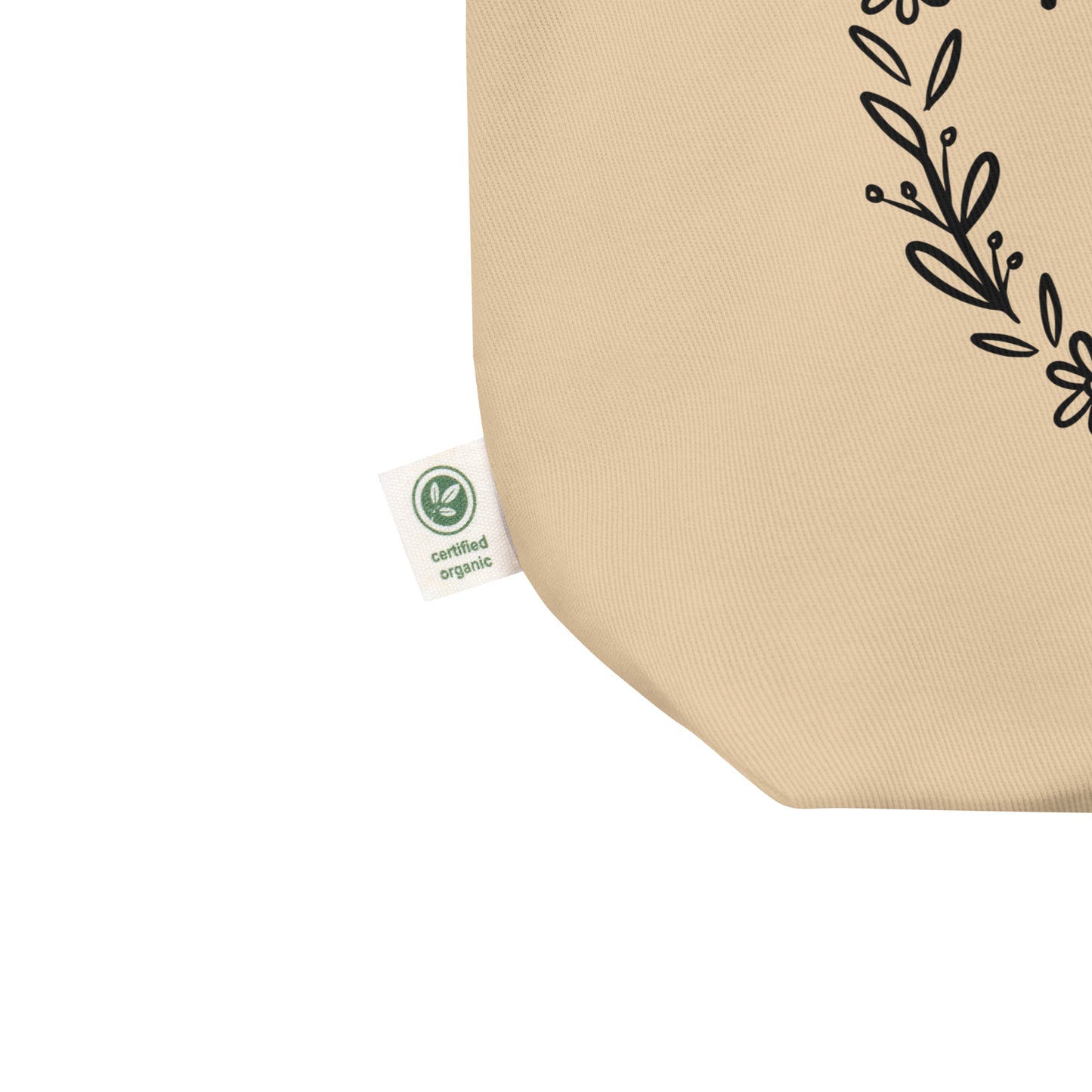 Close-up of certified organic cotton tag on eco-friendly canvas tote bag.