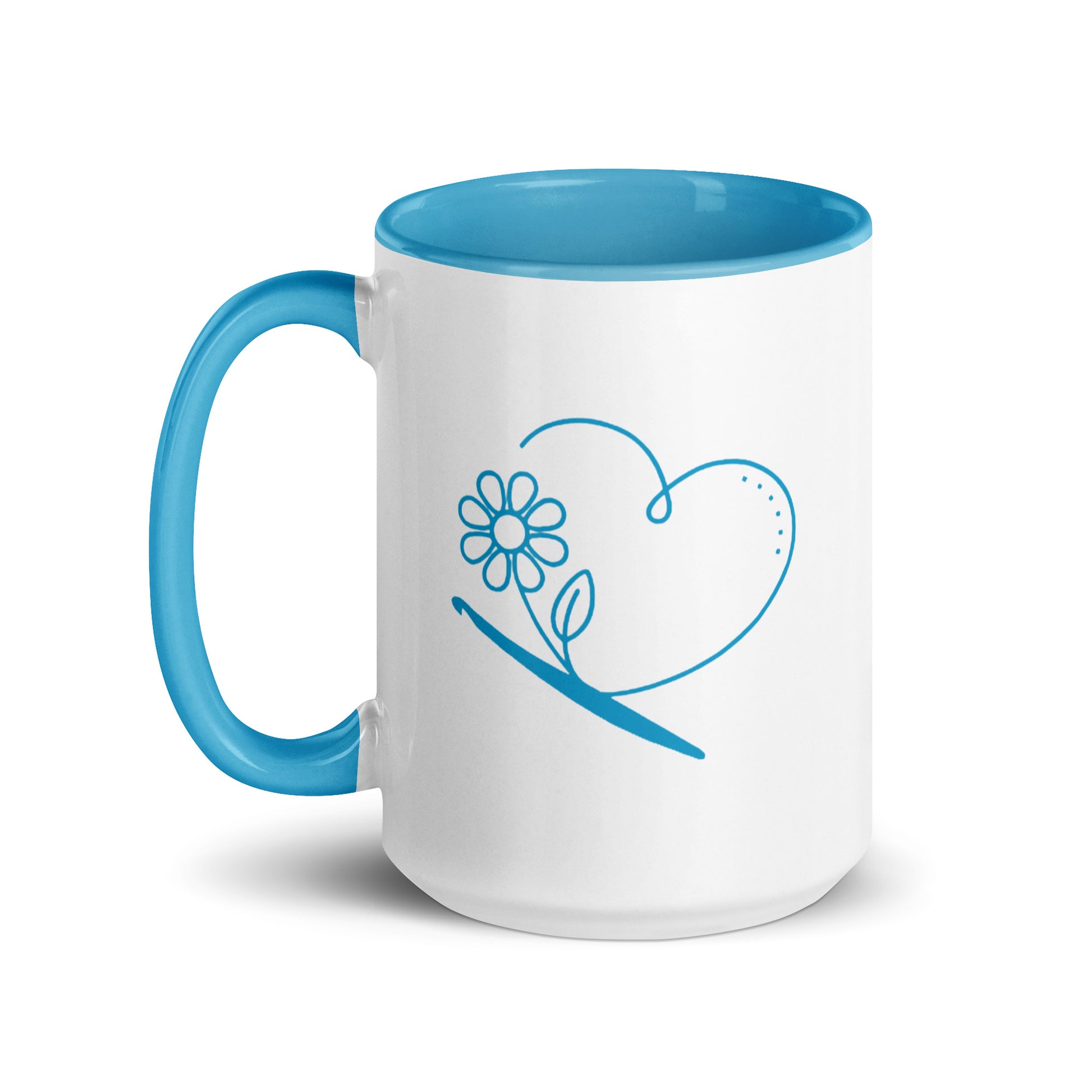 White ceramic mug with blue interior and handle featuring a minimalist heart, flower, and crochet hook line-art design.