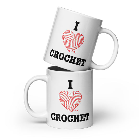 Two tall 20oz white glossy mugs stacked vertically, showcasing the I Heart Crochet design with a red yarn-heart and bold CROCHET text in a bright, minimal product mockup.