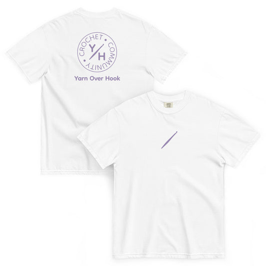 White Comfort Colors t-shirt with a purple crochet hook on the front and Yarn Over Hook Crochet Community logo printed on the back.