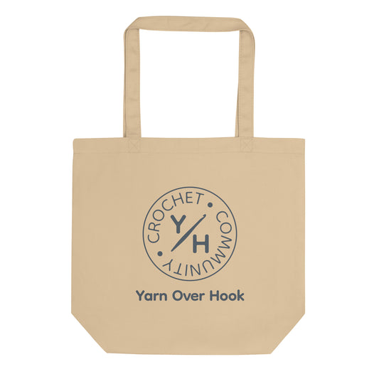 Oyster organic cotton tote bag with Yarn Over Hook Crochet Community logo printed in slate on the front.
